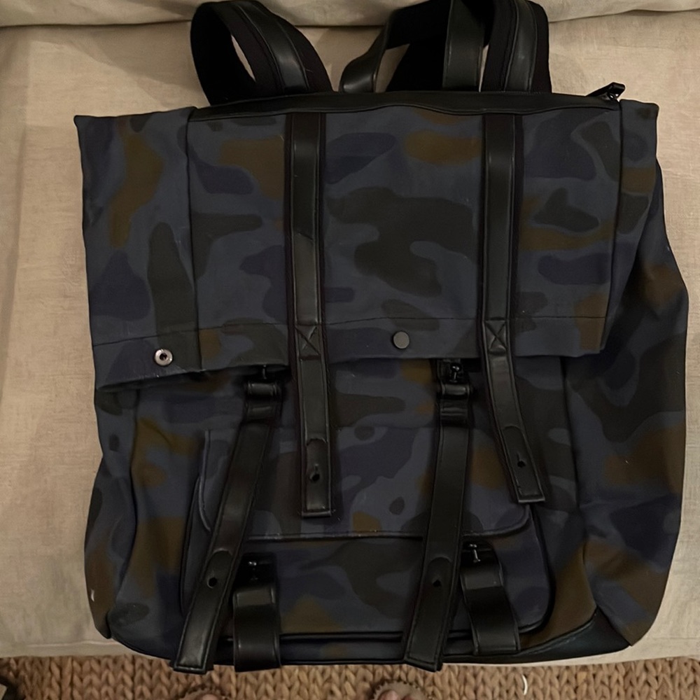 Phillip Lim large camo colored canvas backpack with leather accents.